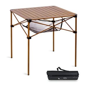 iClimb Lightweight Stable Aluminum Folding Table set up outdoors, perfect for camping and picnics