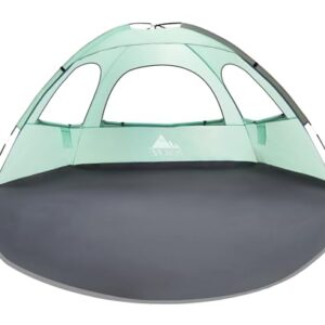 NXONE Beach Tent with UV protection, featuring an extended floor, roll-up windows, and a durable fiberglass frame, set up on a sandy beach with carrying bag included