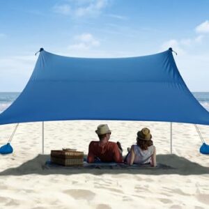 Vibemo 10 x 10 ft Beach Tent with UPF 50+ protection, featuring upgraded 1.5mm poles, sandbags, ground pegs, and a sand shovel, set up on a sandy beach with a compact travel bag included
