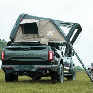 Naturnest pop-up rooftop tent in grey mounted on an SUV. Features include a quick setup design, spacious interior, and included accessories like an aluminum ladder and LED light strip.