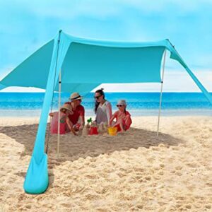 FBSPORT Beach Tent in Khaki Set Up on a Beach with Adjustable Side Curtains, Sandbags, and Carrying Bag