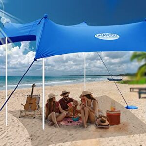 Family Beach Tent Canopy in vibrant blue, showcasing a 10×10 FT portable sun shade setup at the beach with four aluminum poles, sandbags, and windproof ropes for stability and protection. Ideal for outdoor travel with UPF 50+ sun protection.
